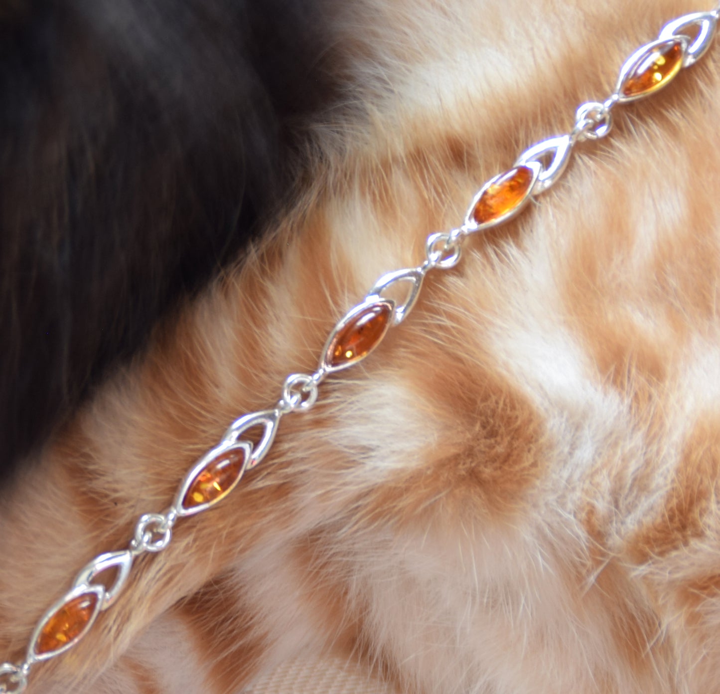 Bright adjustable bracelet created with natural cognac-colored Amber and 925 Silver, MJ Baltica, BB104