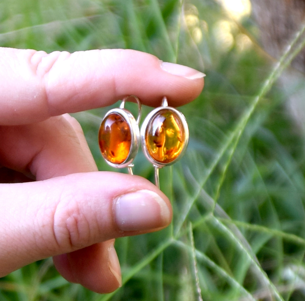 Bright earrings with a leverback closure, made with natural cognac-colored oval Amber and 925 Silver, MJ Baltica, BK047