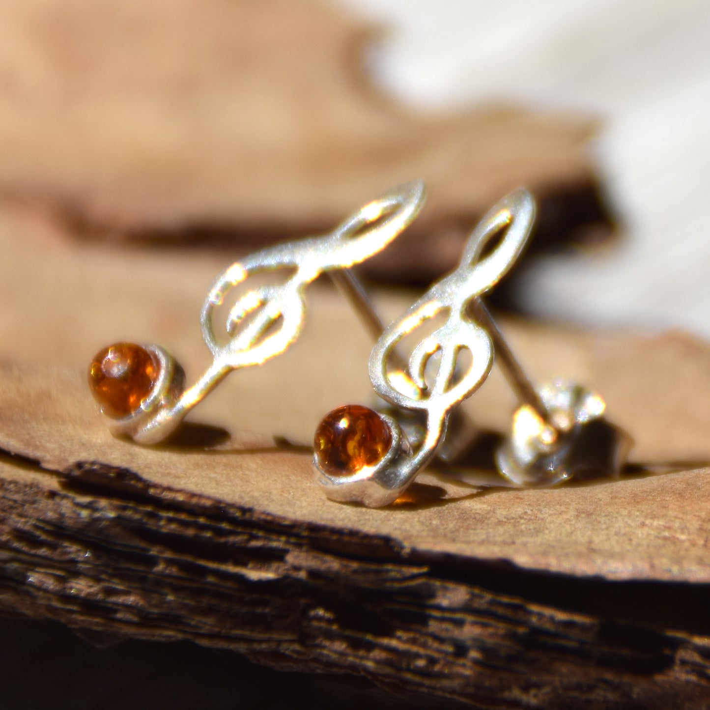 Delicate stud earrings with a musical note in natural cognac amber and 925 Silver, MJ Baltica, BK191