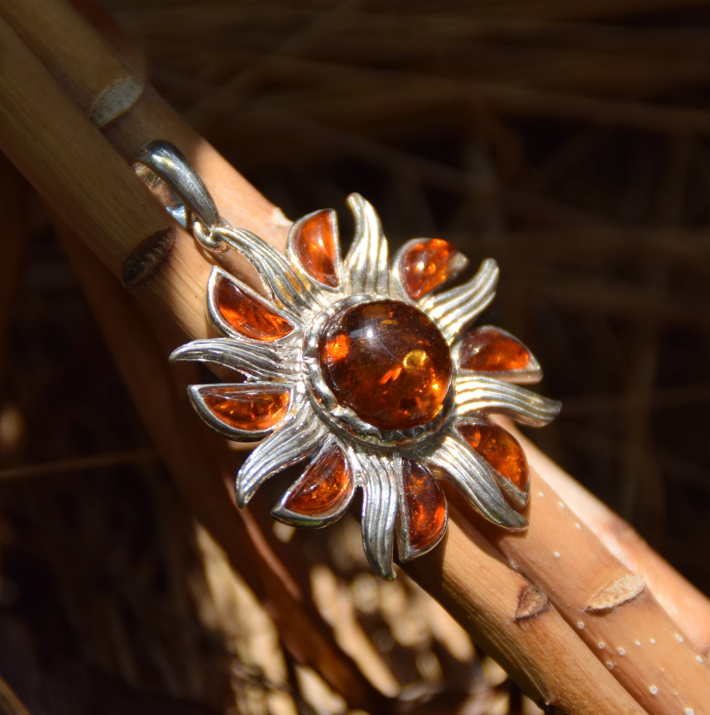 Pendant with sun with brilliant rays in natural cognac-colored Amber and 925 Silver, MJ Baltica, BW279