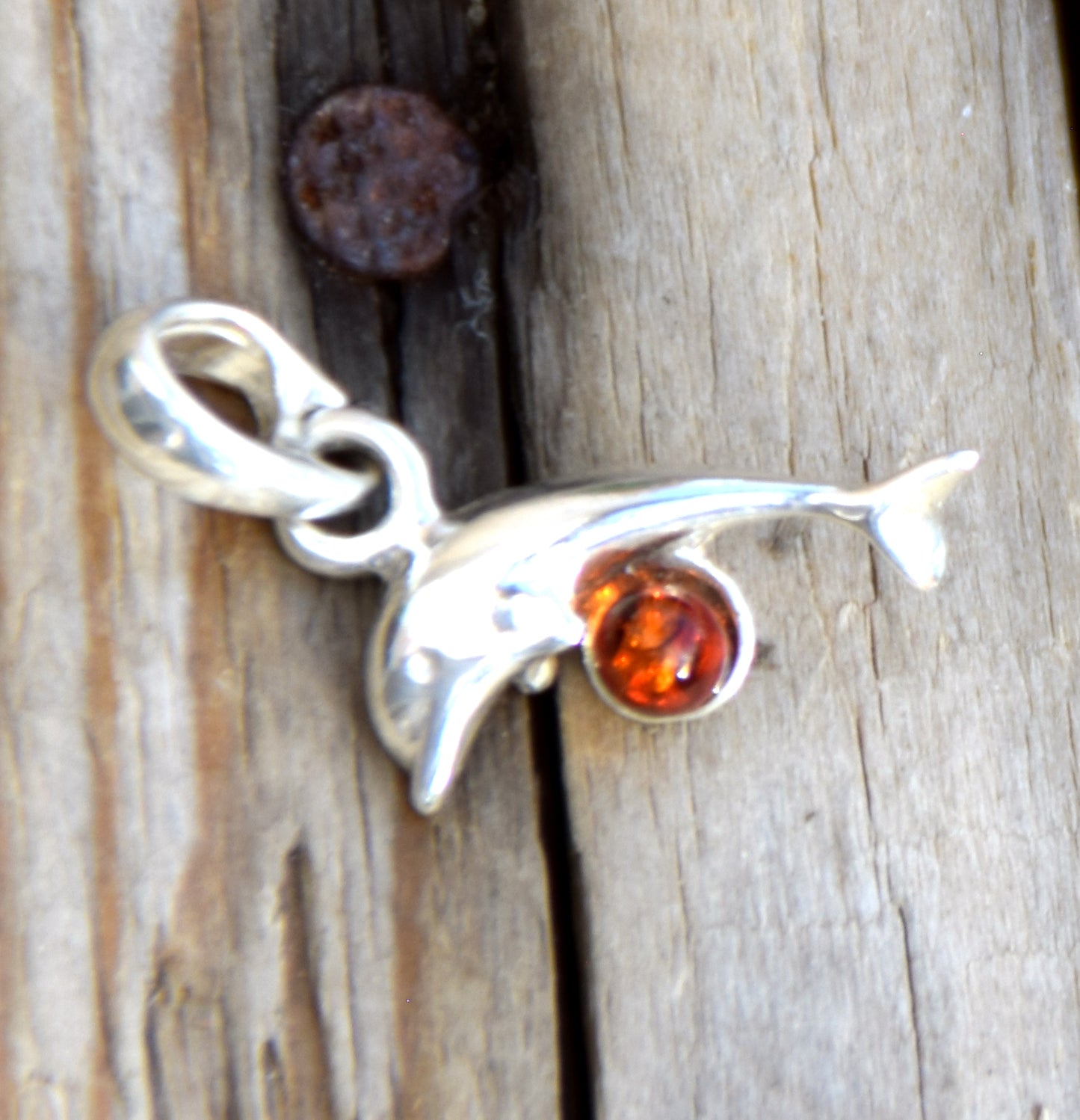 Delicate pendant with a joyful dolphin in cognac-colored natural Amber and 925 Silver, MJ Baltica, BW315