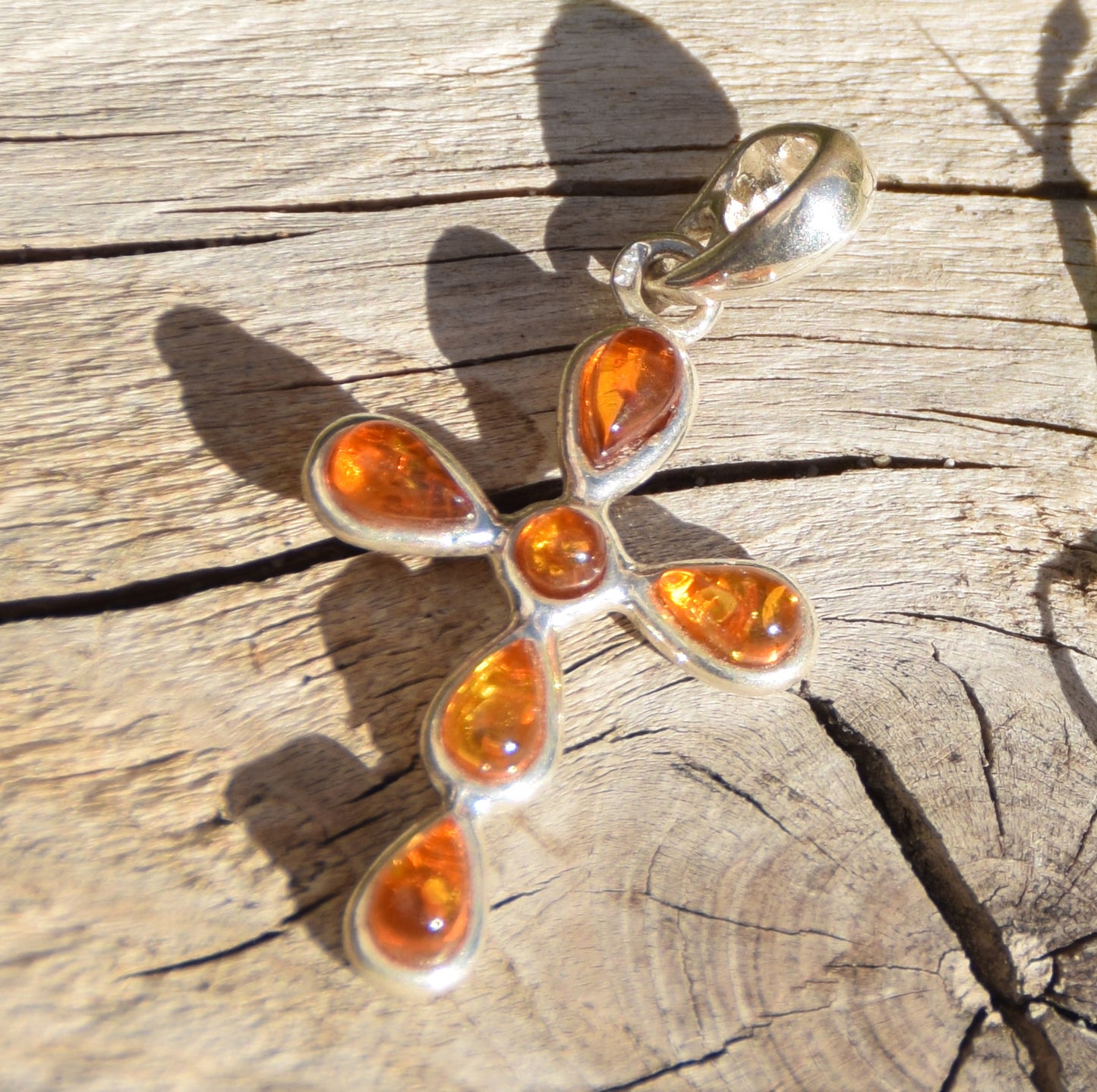 Delicate cross-shaped pendant in natural cognac Amber and 925 Silver, MJ Baltica, BW329