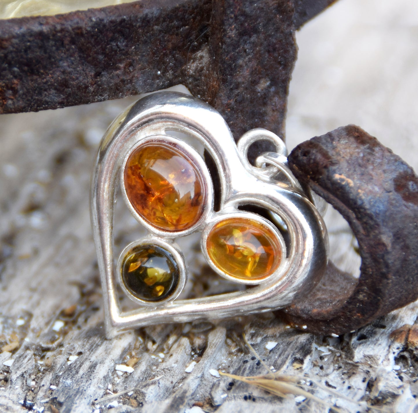 Romantic heart-shaped pendant with natural Amber of various shades and 925 Sterling Silver, MJ Baltica, BW330