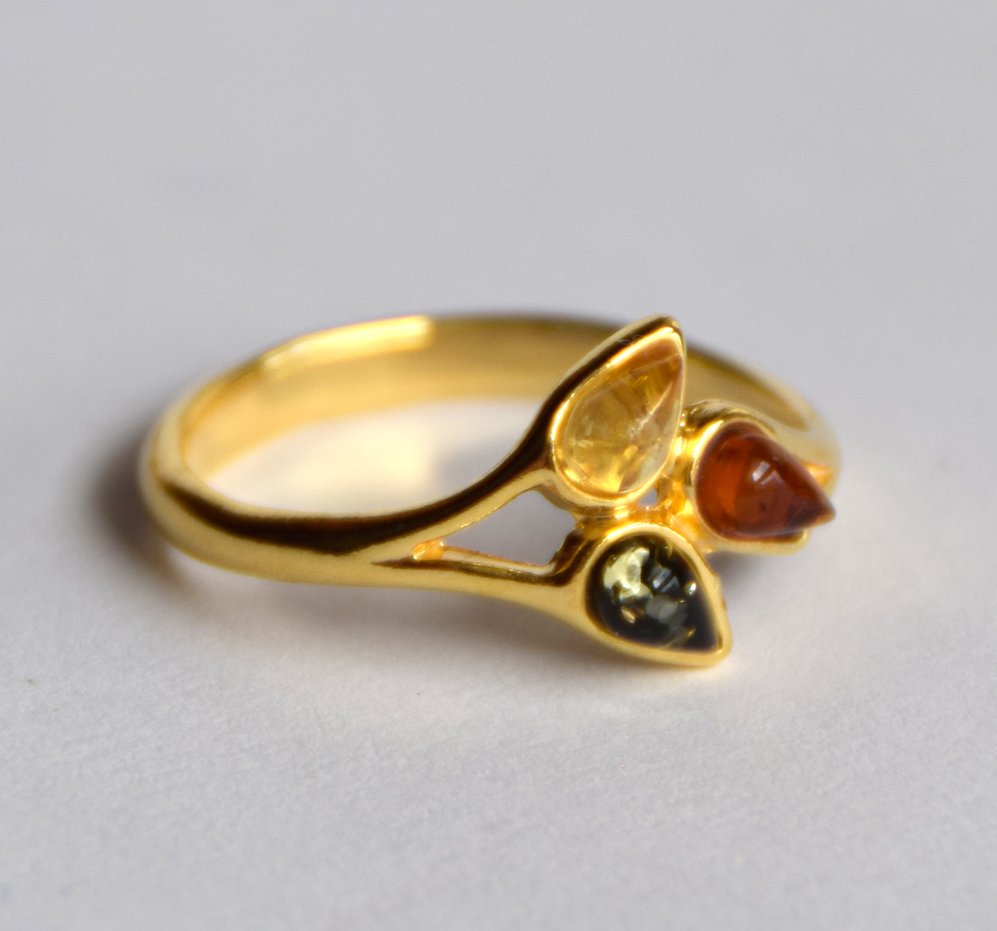 Delicate luminous floral-style ring created with natural Amber of various shades and 18k Gold plated Silver, MJ Baltica, BZP046