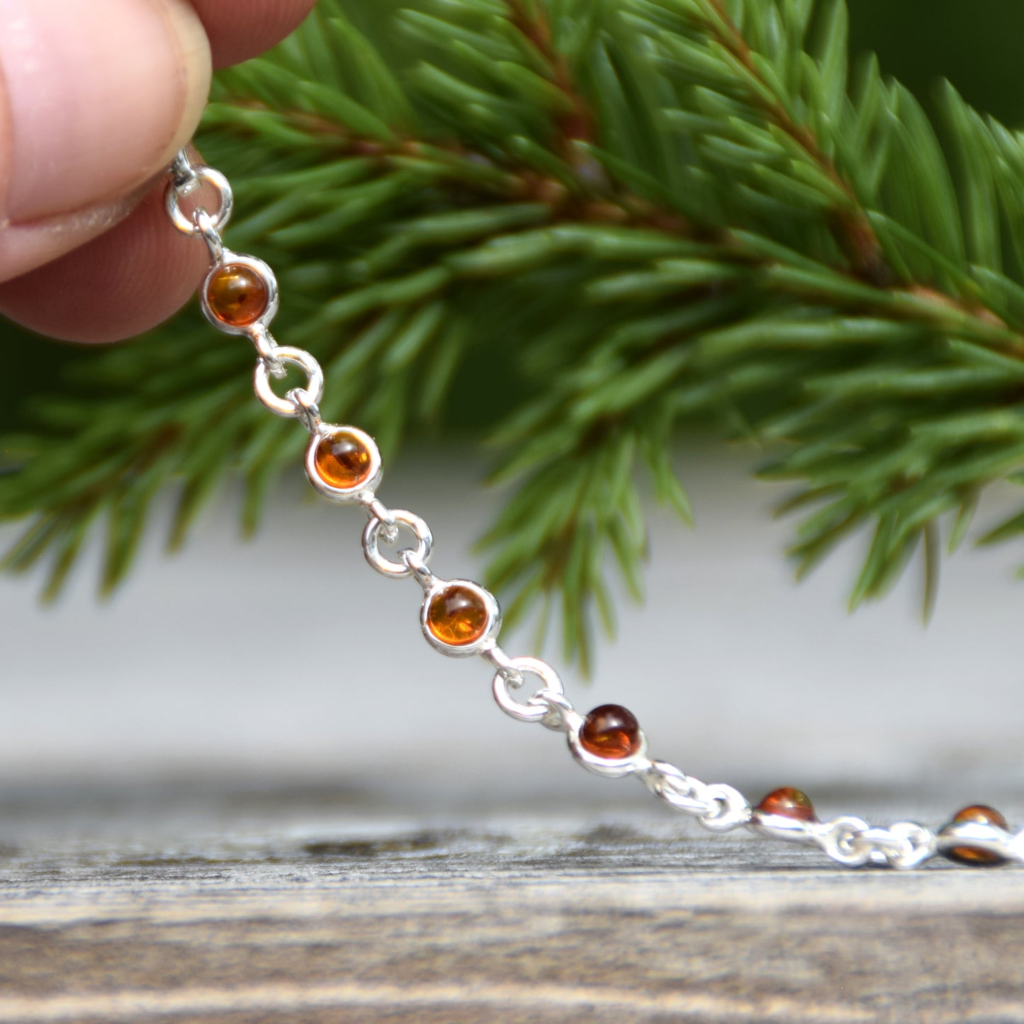 Delicate adjustable chain bracelet crafted with cognac-colored natural Amber and 925 Sterling Silver, MJ Baltica, BB014