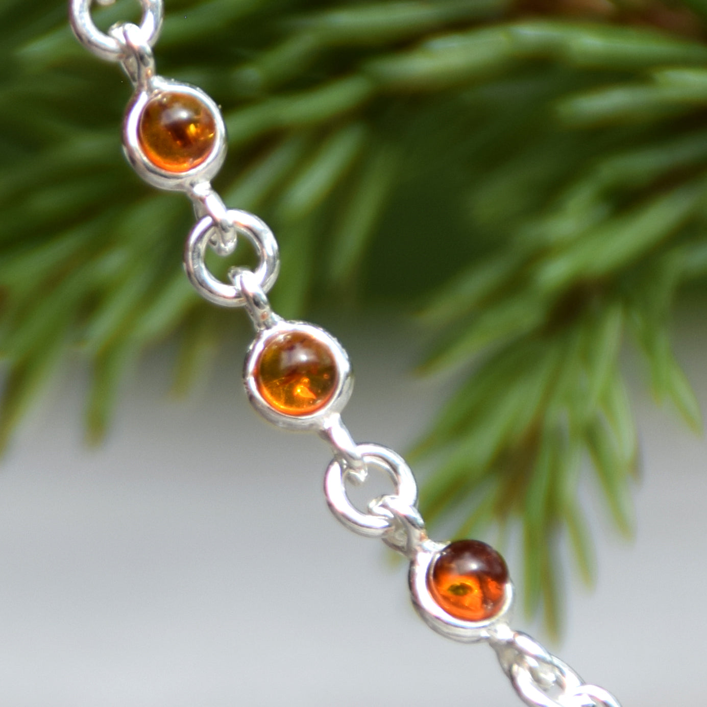 Delicate adjustable chain bracelet crafted with cognac-colored natural Amber and 925 Sterling Silver, MJ Baltica, BB014