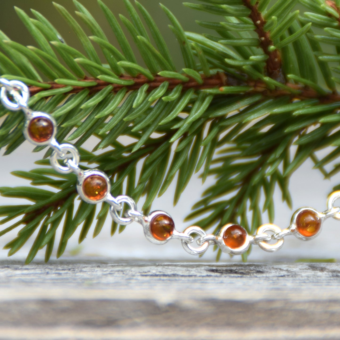 Delicate adjustable chain bracelet crafted with cognac-colored natural Amber and 925 Sterling Silver, MJ Baltica, BB014