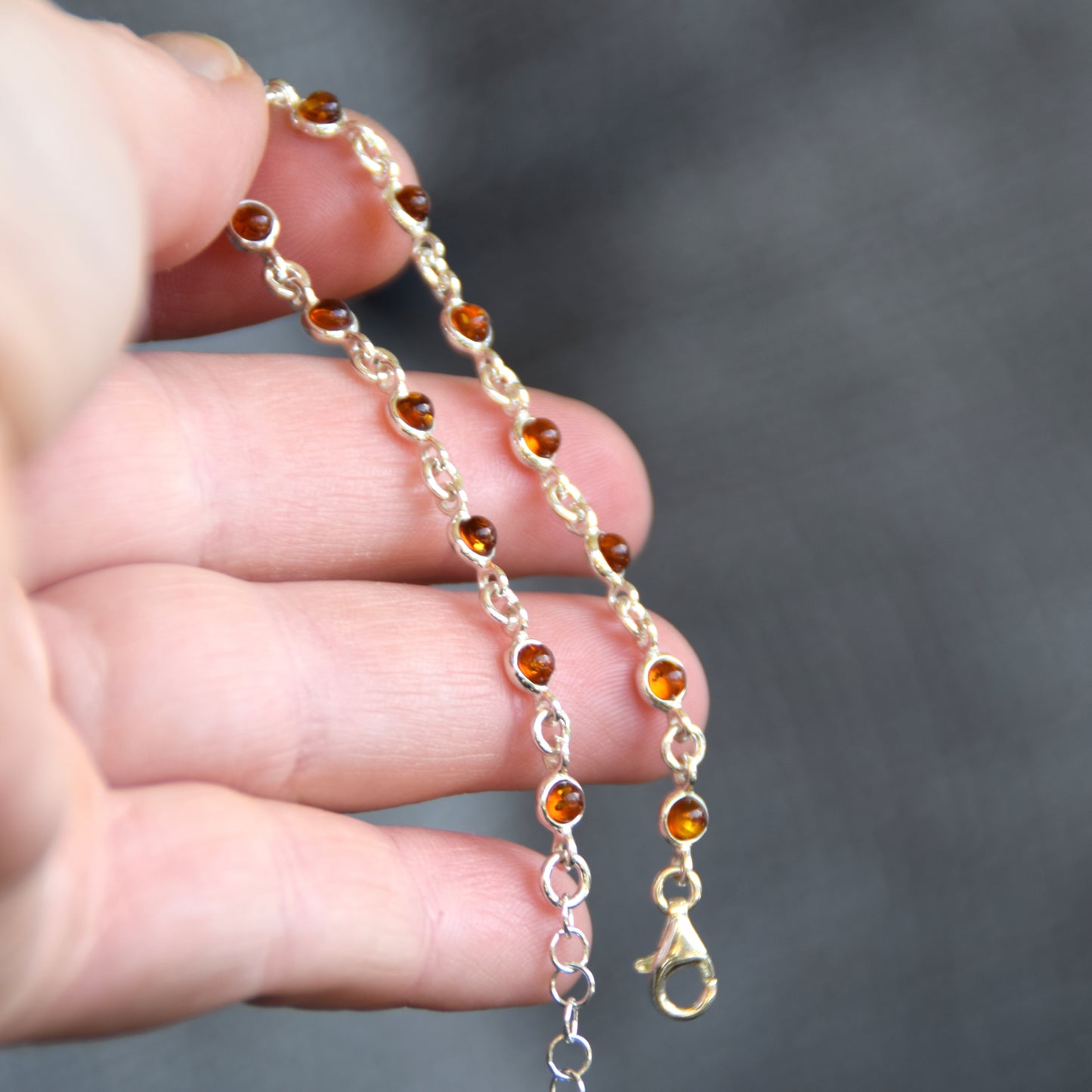 Delicate adjustable chain bracelet crafted with cognac-colored natural Amber and 925 Sterling Silver, MJ Baltica, BB014