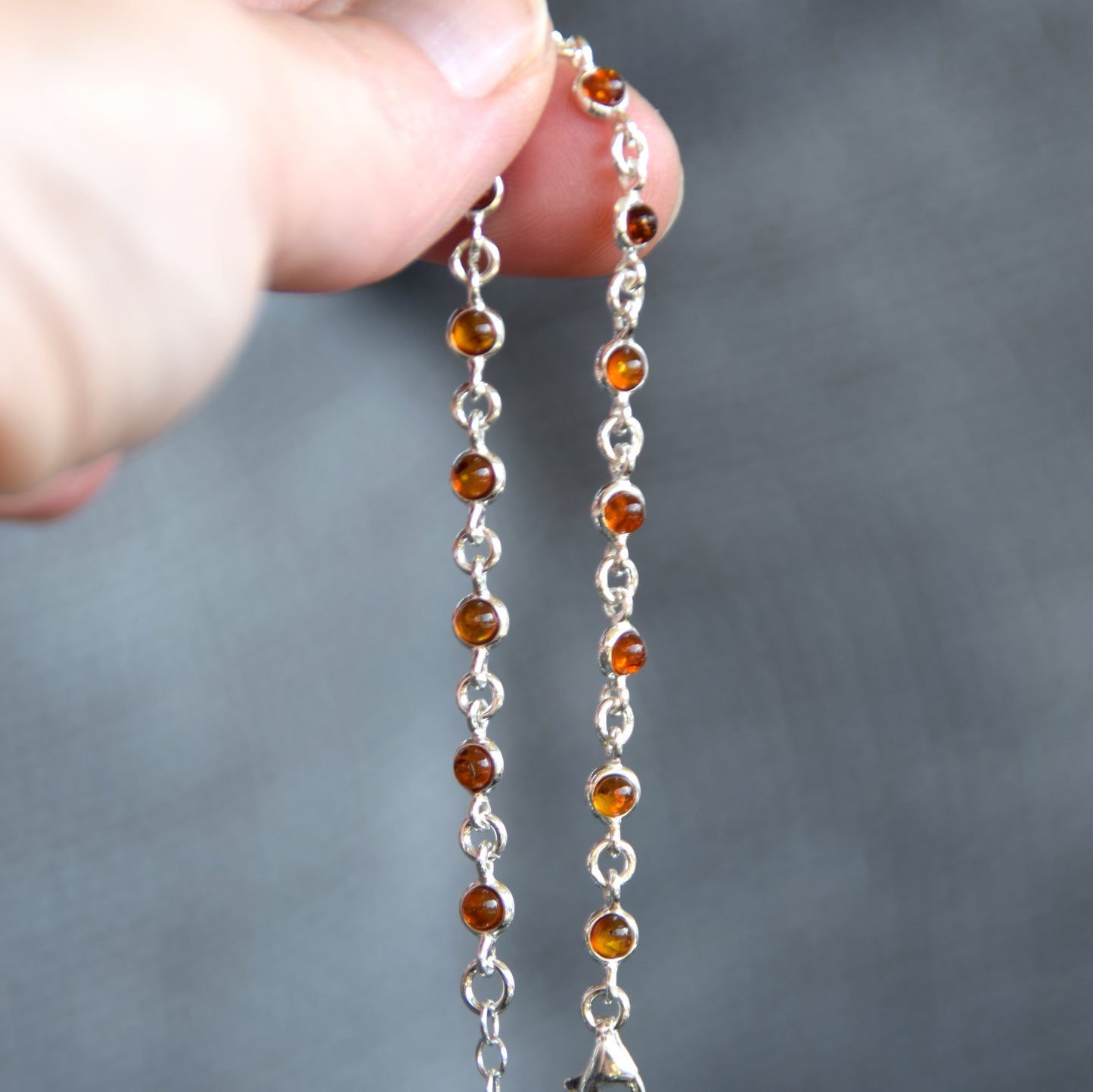 Delicate adjustable chain bracelet crafted with cognac-colored natural Amber and 925 Sterling Silver, MJ Baltica, BB014