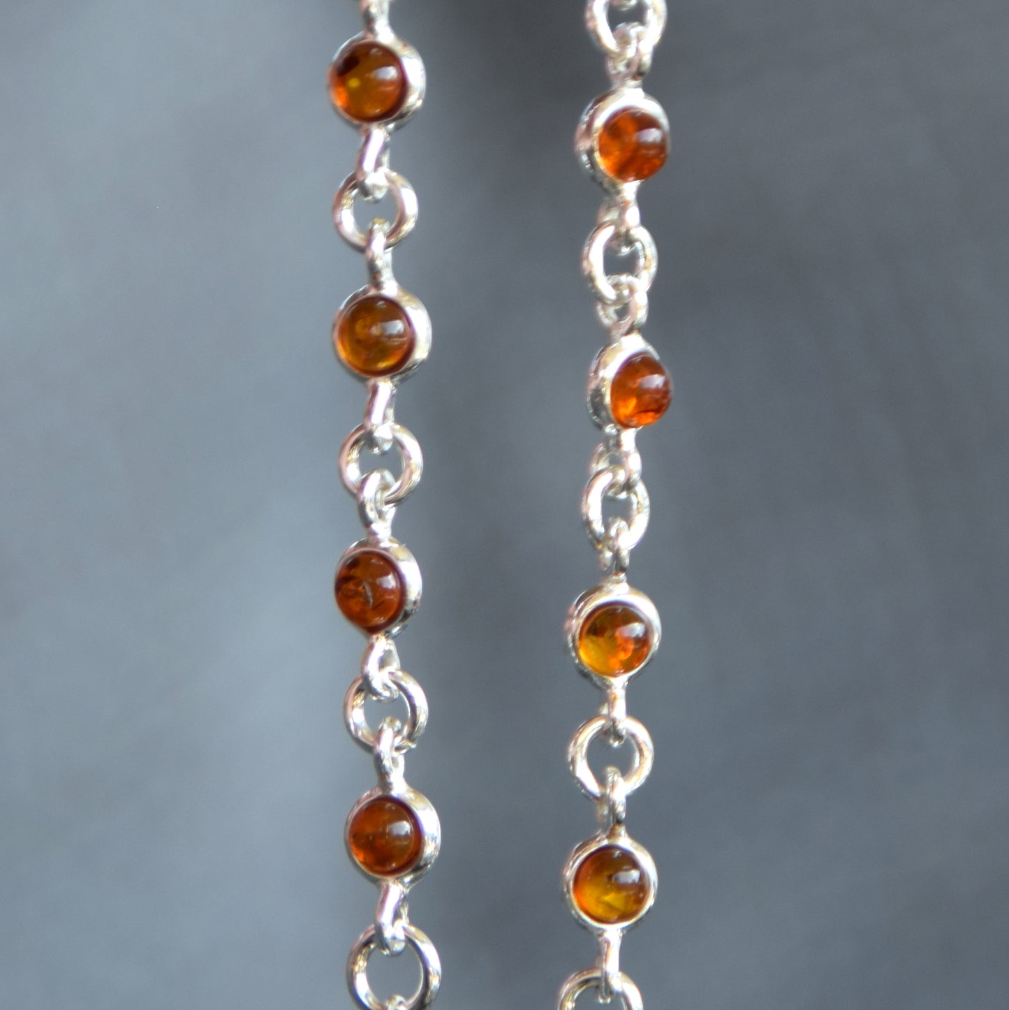 Delicate adjustable chain bracelet crafted with cognac-colored natural Amber and 925 Sterling Silver, MJ Baltica, BB014
