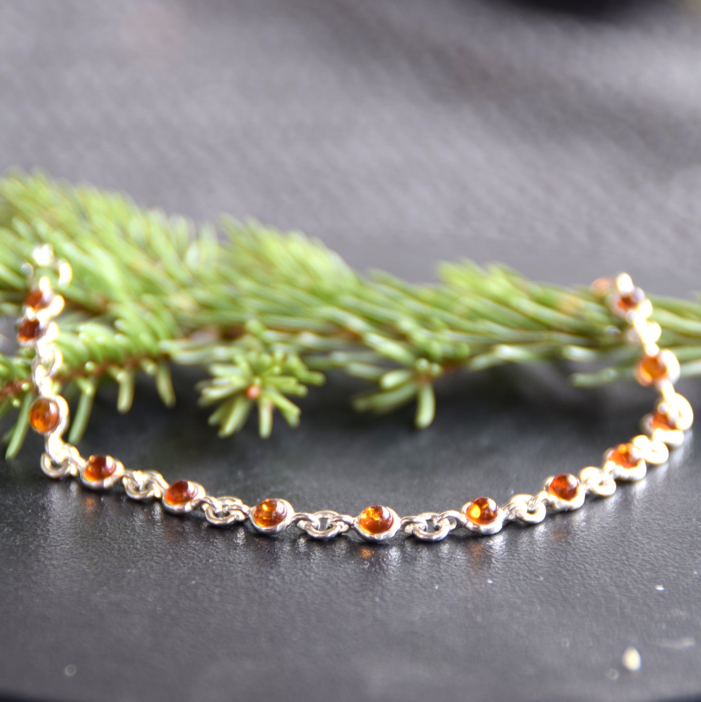 Delicate adjustable chain bracelet crafted with cognac-colored natural Amber and 925 Sterling Silver, MJ Baltica, BB014
