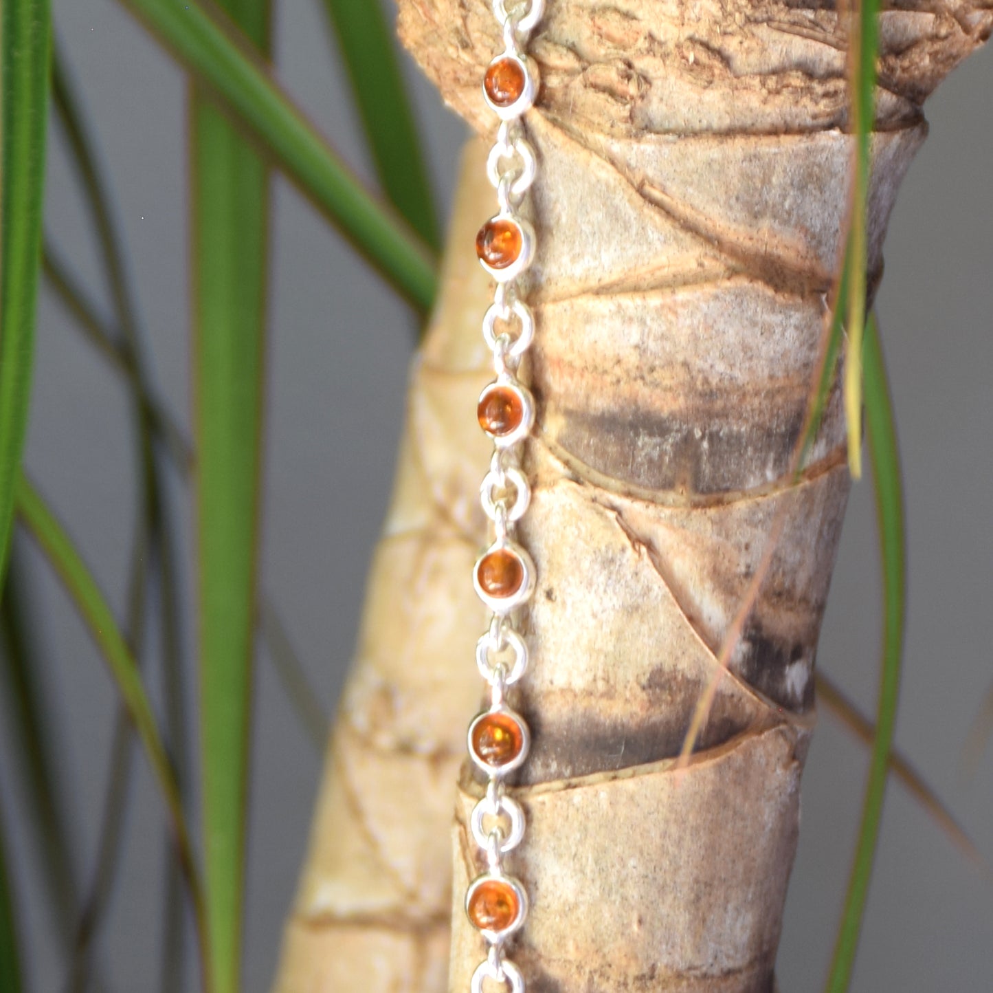 Delicate adjustable chain bracelet crafted with cognac-colored natural Amber and 925 Sterling Silver, MJ Baltica, BB014