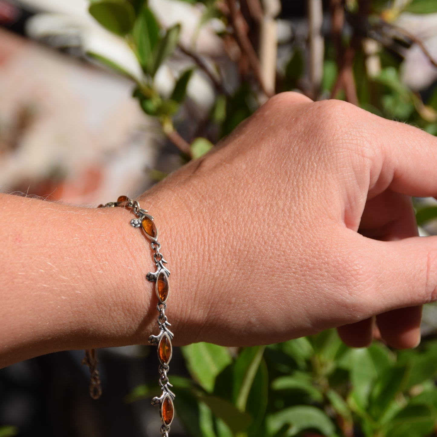 Delicate vintage style bracelet with floral decoration in natural cognac amber and 925 sterling silver, MJ Baltica, BB040
