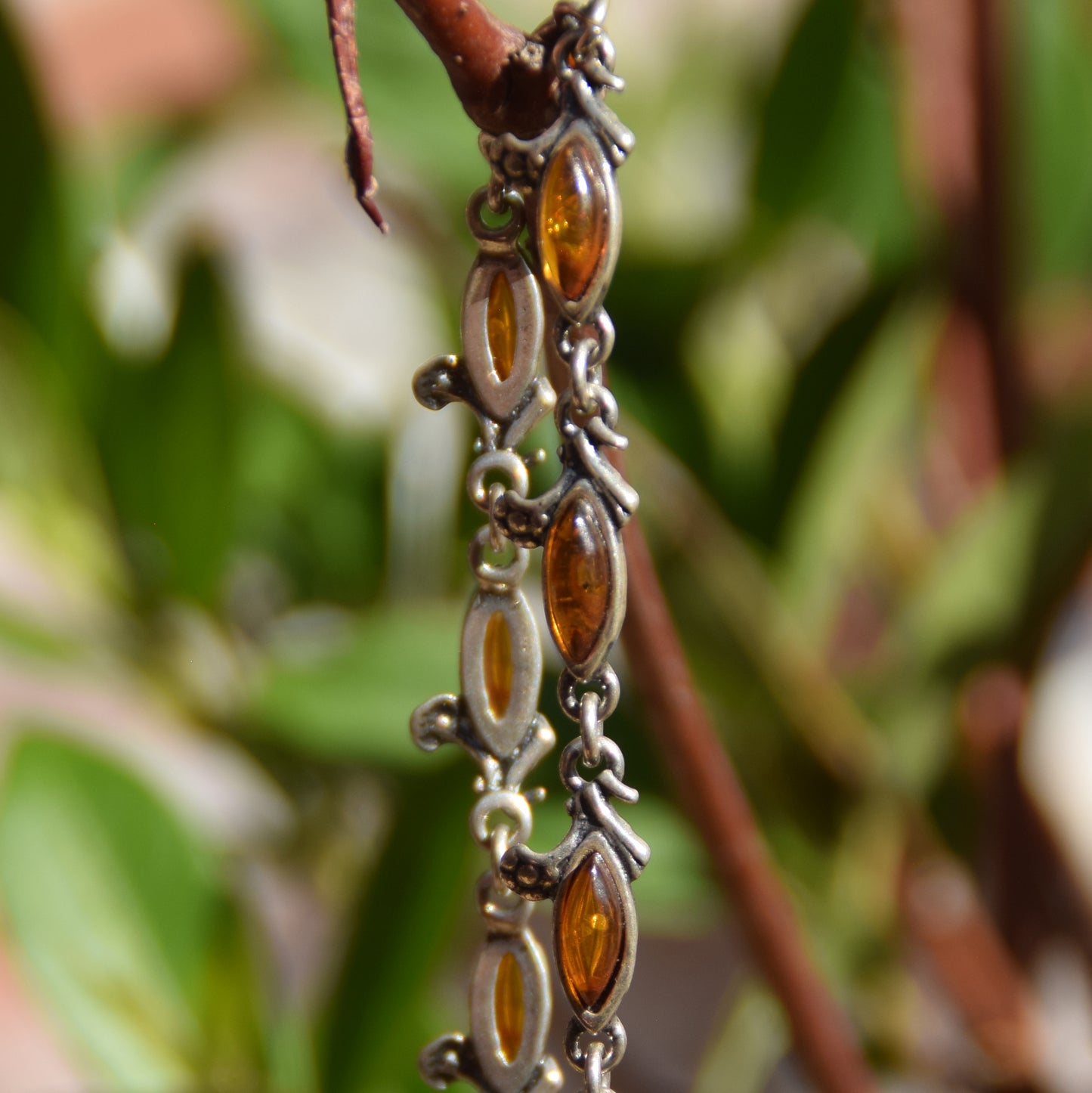 Delicate vintage style bracelet with floral decoration in natural cognac amber and 925 sterling silver, MJ Baltica, BB040
