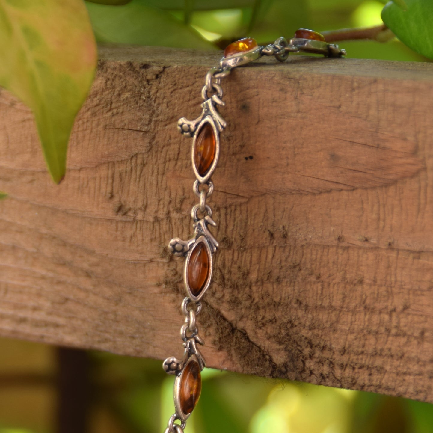 Delicate vintage style bracelet with floral decoration in natural cognac amber and 925 sterling silver, MJ Baltica, BB040