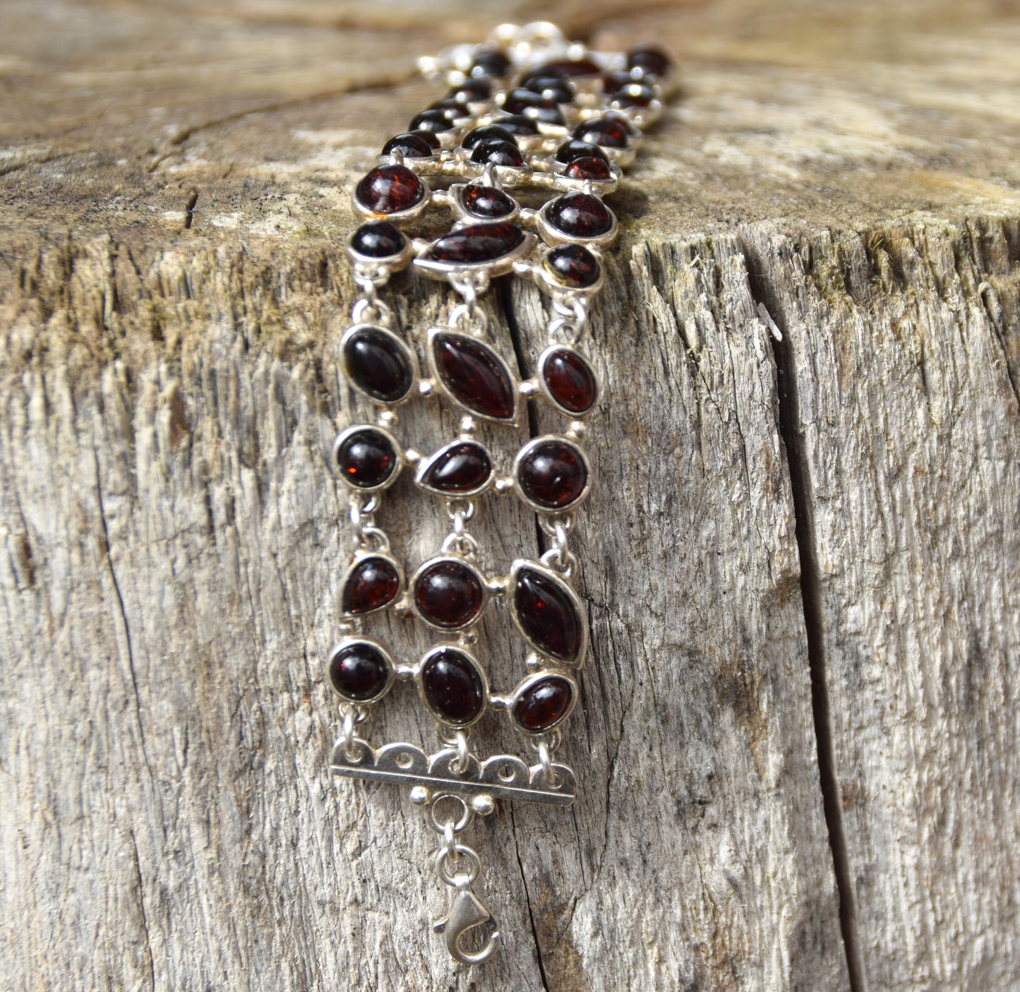 High cuff bracelet with gem mosaic created with dark brown natural amber and 925 silver, MJ Baltica, BB062