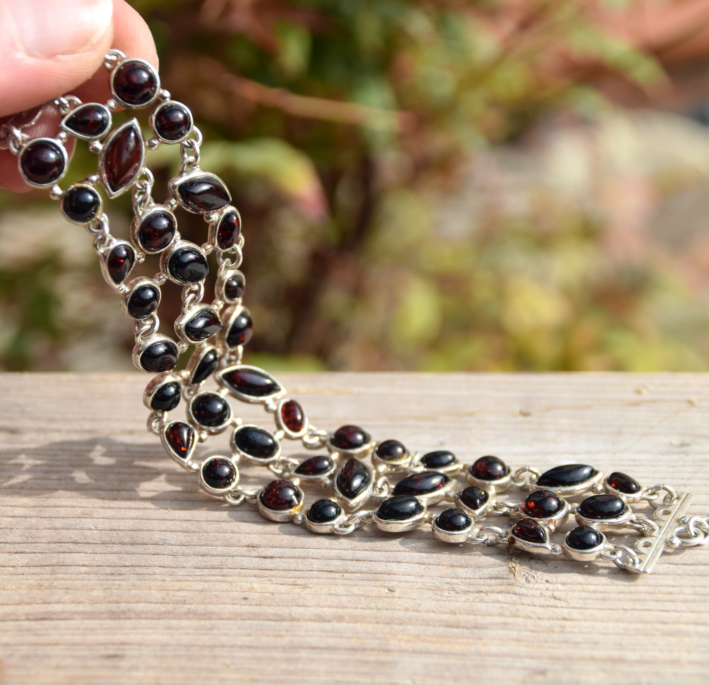 High cuff bracelet with gem mosaic created with dark brown natural amber and 925 silver, MJ Baltica, BB062