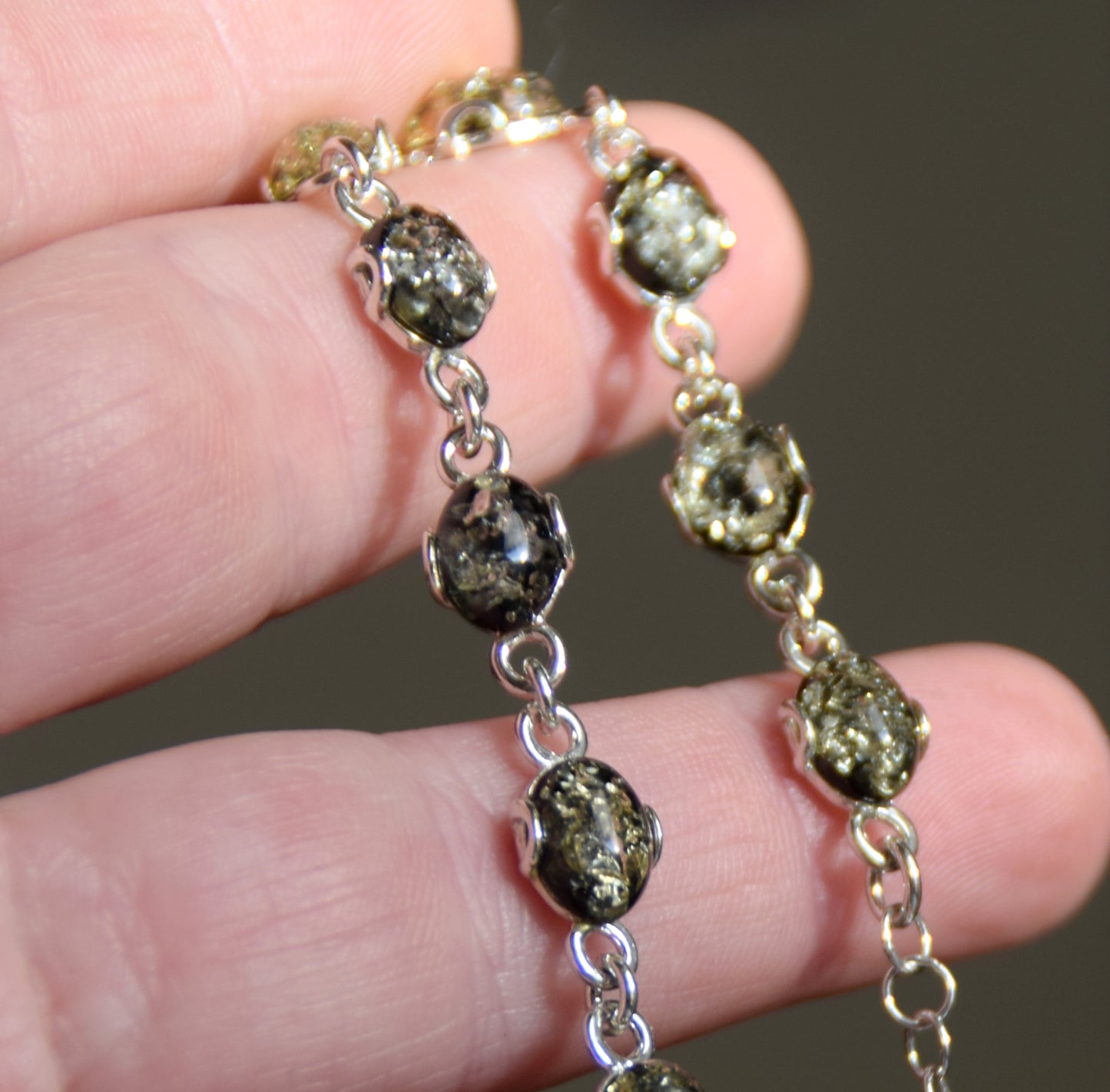 Adjustable chain bracelet in an essential style crafted from natural green amber and 925 sterling silver, MJ Baltica, BB105