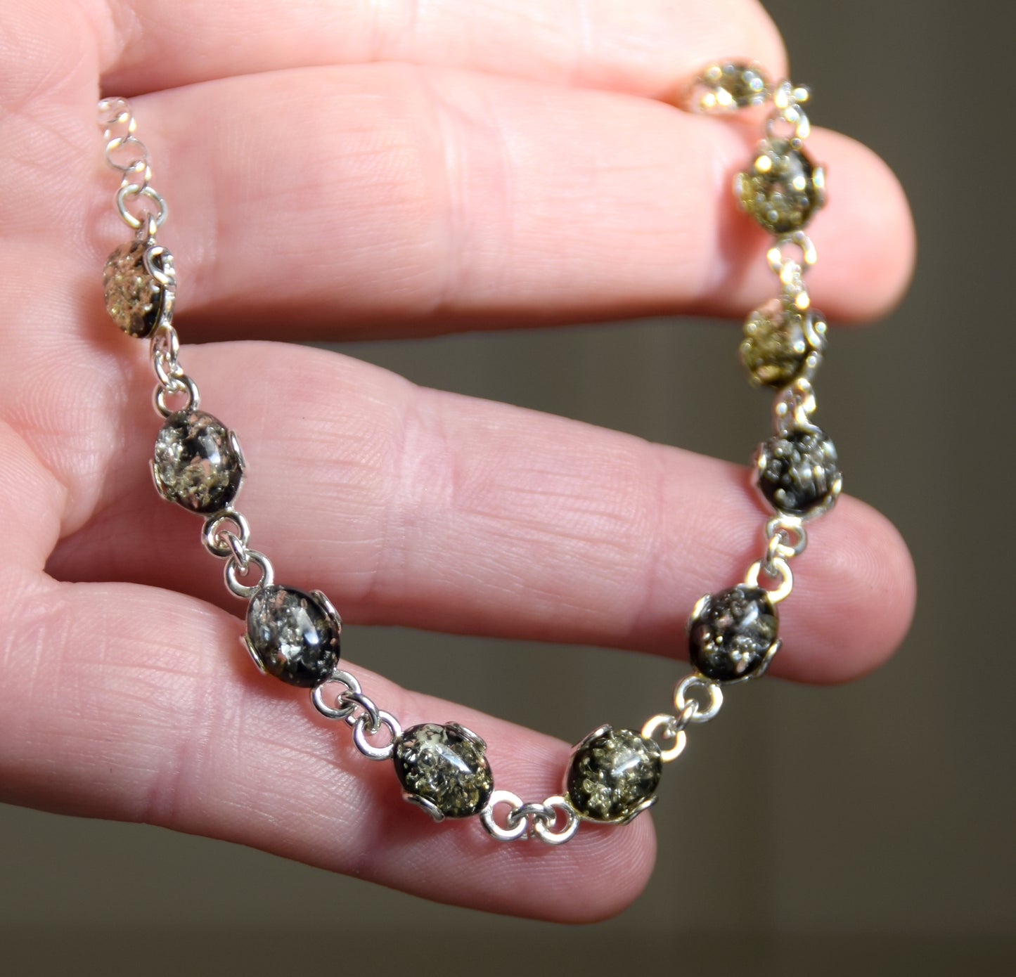 Adjustable chain bracelet in an essential style crafted from natural green amber and 925 sterling silver, MJ Baltica, BB105