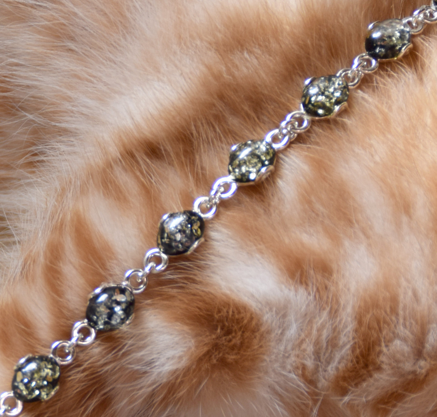 Adjustable chain bracelet in an essential style crafted from natural green amber and 925 sterling silver, MJ Baltica, BB105