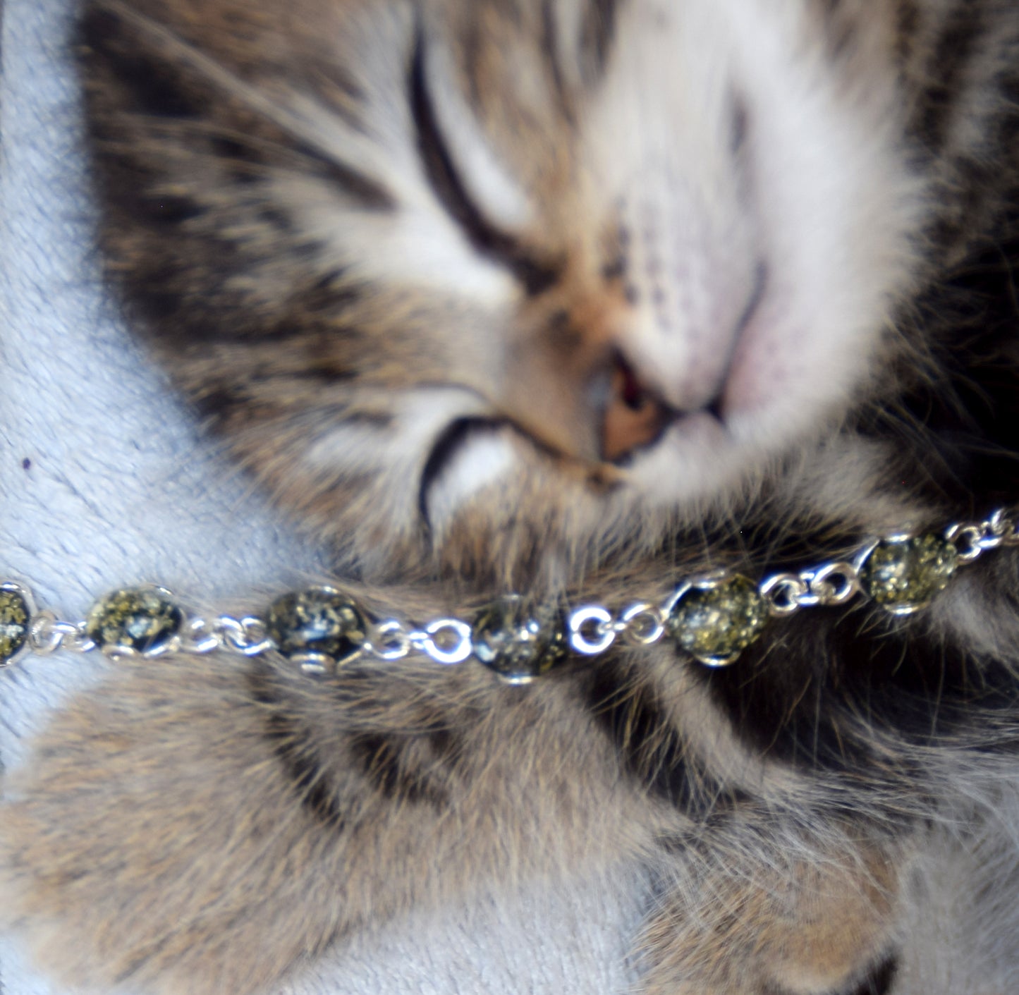 Adjustable chain bracelet in an essential style crafted from natural green amber and 925 sterling silver, MJ Baltica, BB105