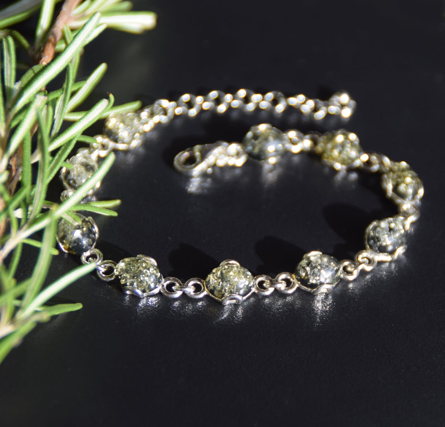 Adjustable chain bracelet in an essential style crafted from natural green amber and 925 sterling silver, MJ Baltica, BB105