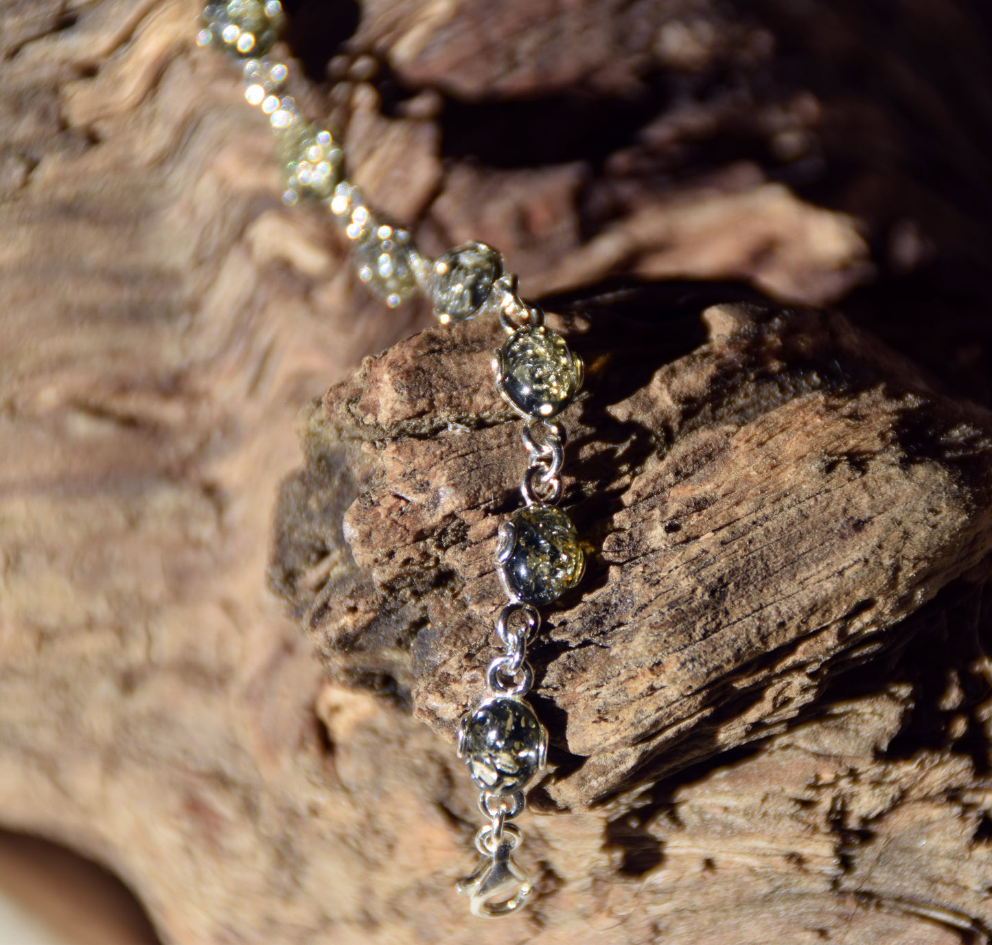 Adjustable chain bracelet in an essential style crafted from natural green amber and 925 sterling silver, MJ Baltica, BB105