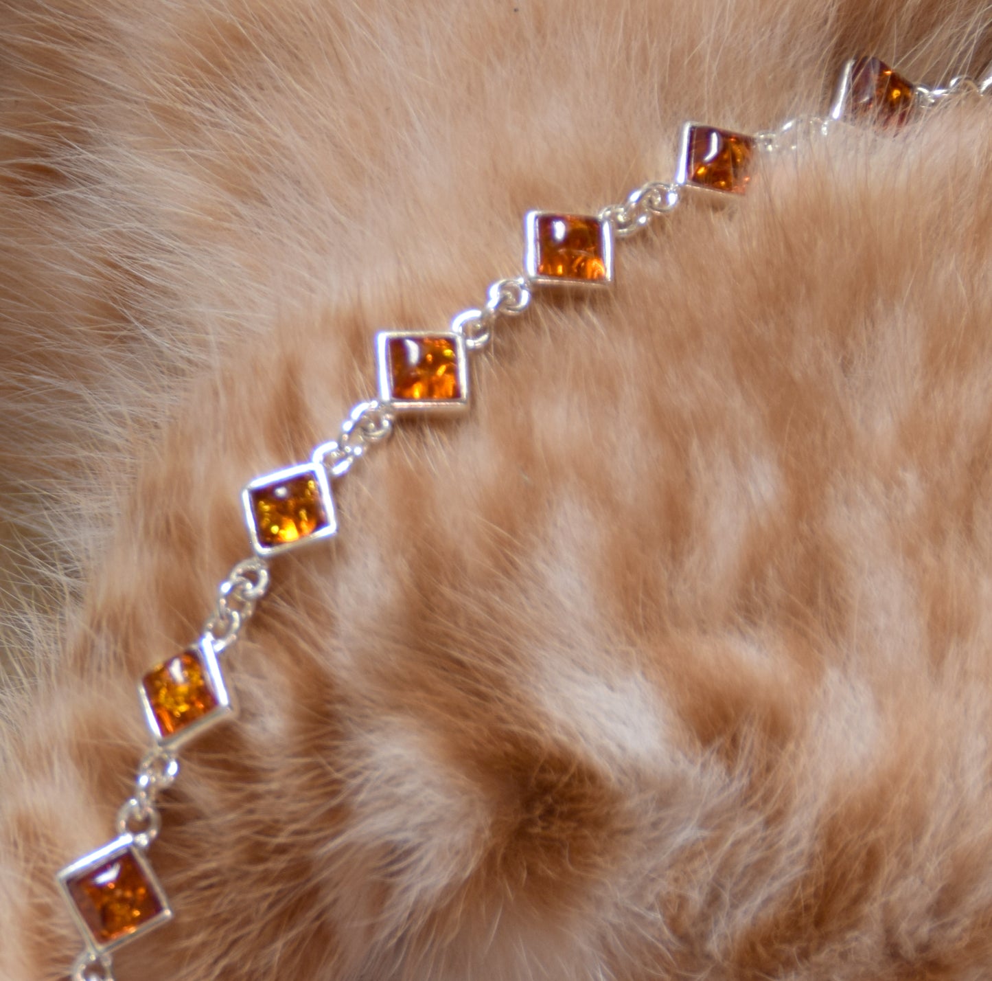 Adjustable minimalist bracelet made with natural cognac-colored Amber and Sterling Silver 925, MJ Baltica, BB111