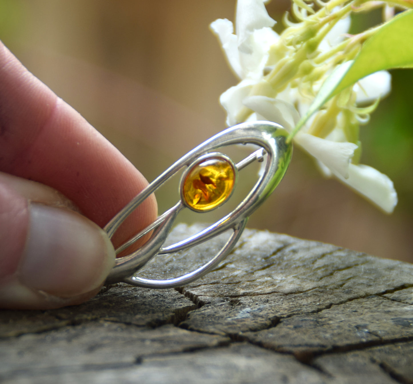 Delicate brooch created with natural cognac-colored amber and 925 Silver, MJ Baltica, BBR002