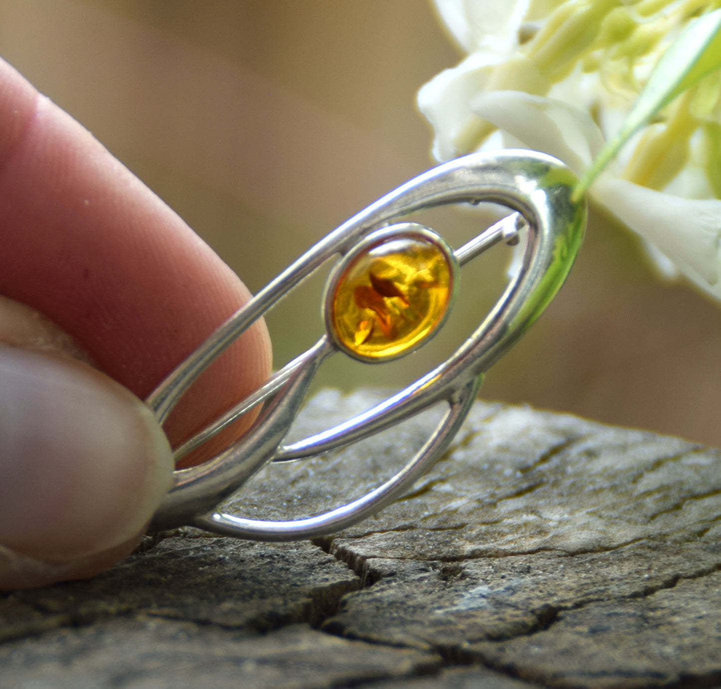 Delicate brooch created with natural cognac-colored amber and 925 Silver, MJ Baltica, BBR002