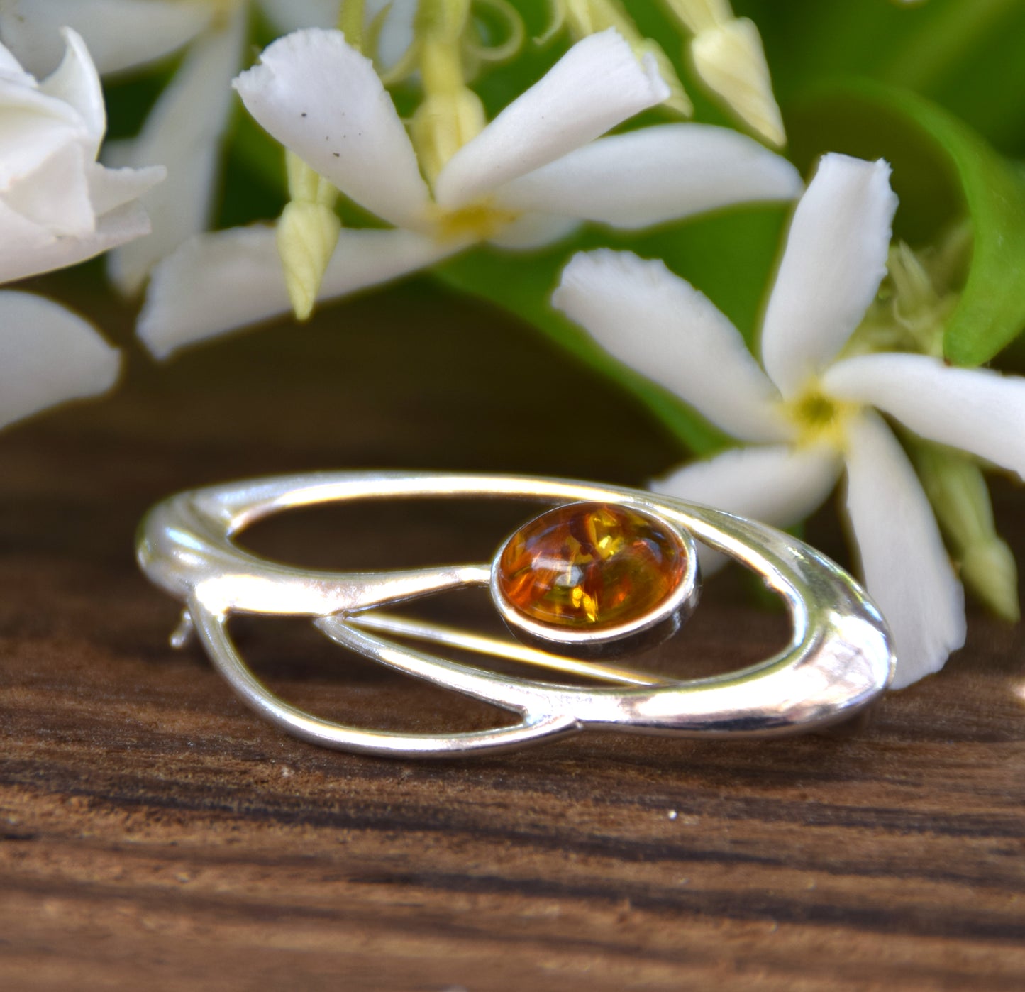 Delicate brooch created with natural cognac-colored amber and 925 Silver, MJ Baltica, BBR002