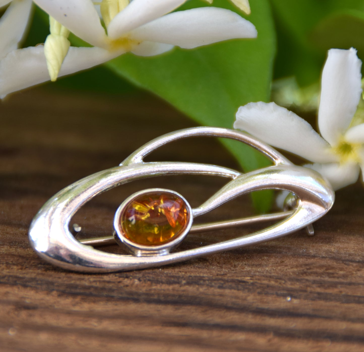 Delicate brooch created with natural cognac-colored amber and 925 Silver, MJ Baltica, BBR002