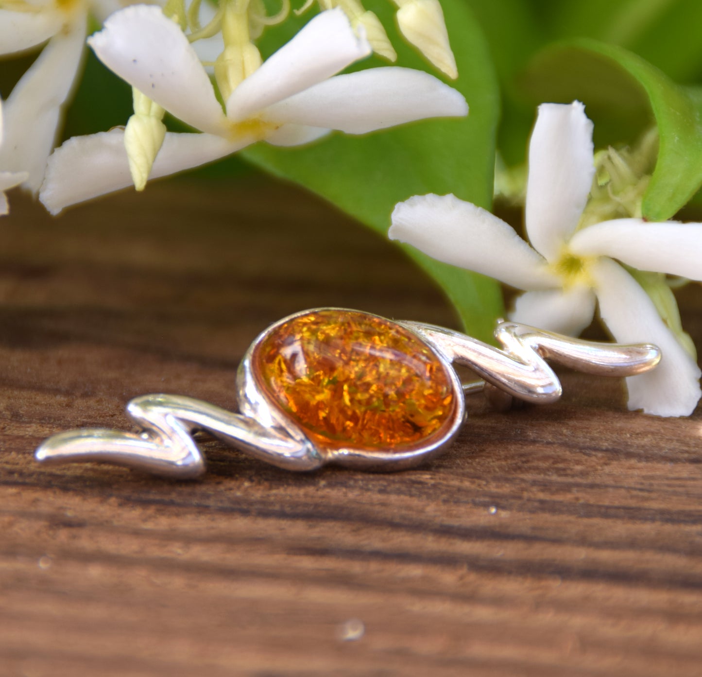 Elegant abstract style brooch crafted with cognac-colored natural Amber and 925 Sterling Silver, MJ Baltica, BBR003