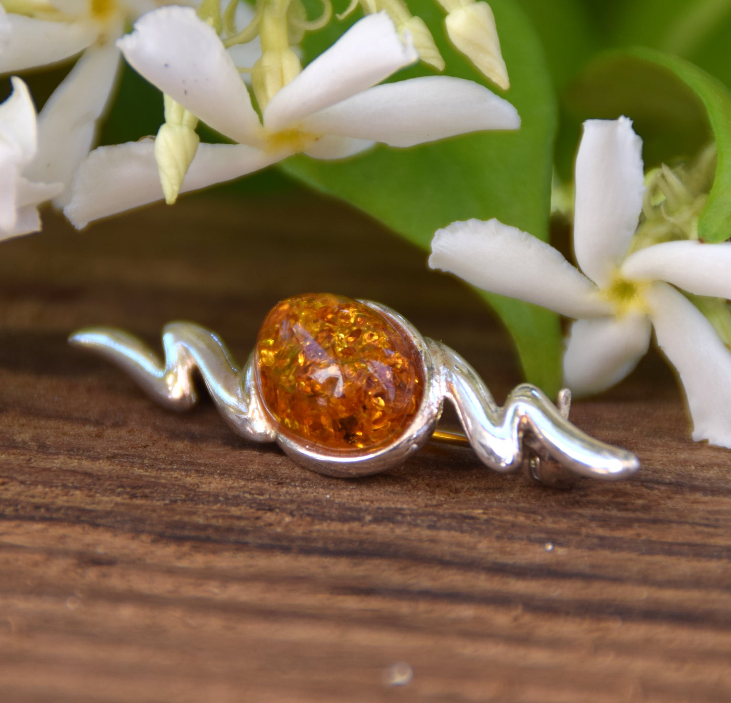 Elegant abstract style brooch crafted with cognac-colored natural Amber and 925 Sterling Silver, MJ Baltica, BBR003