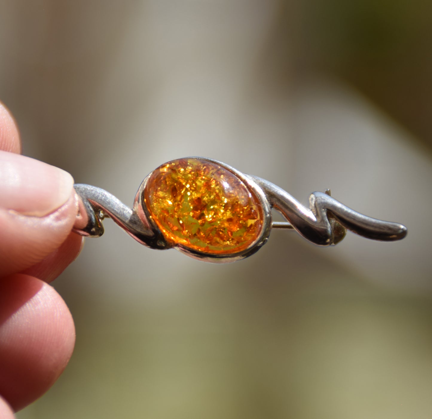 Elegant abstract style brooch crafted with cognac-colored natural Amber and 925 Sterling Silver, MJ Baltica, BBR003