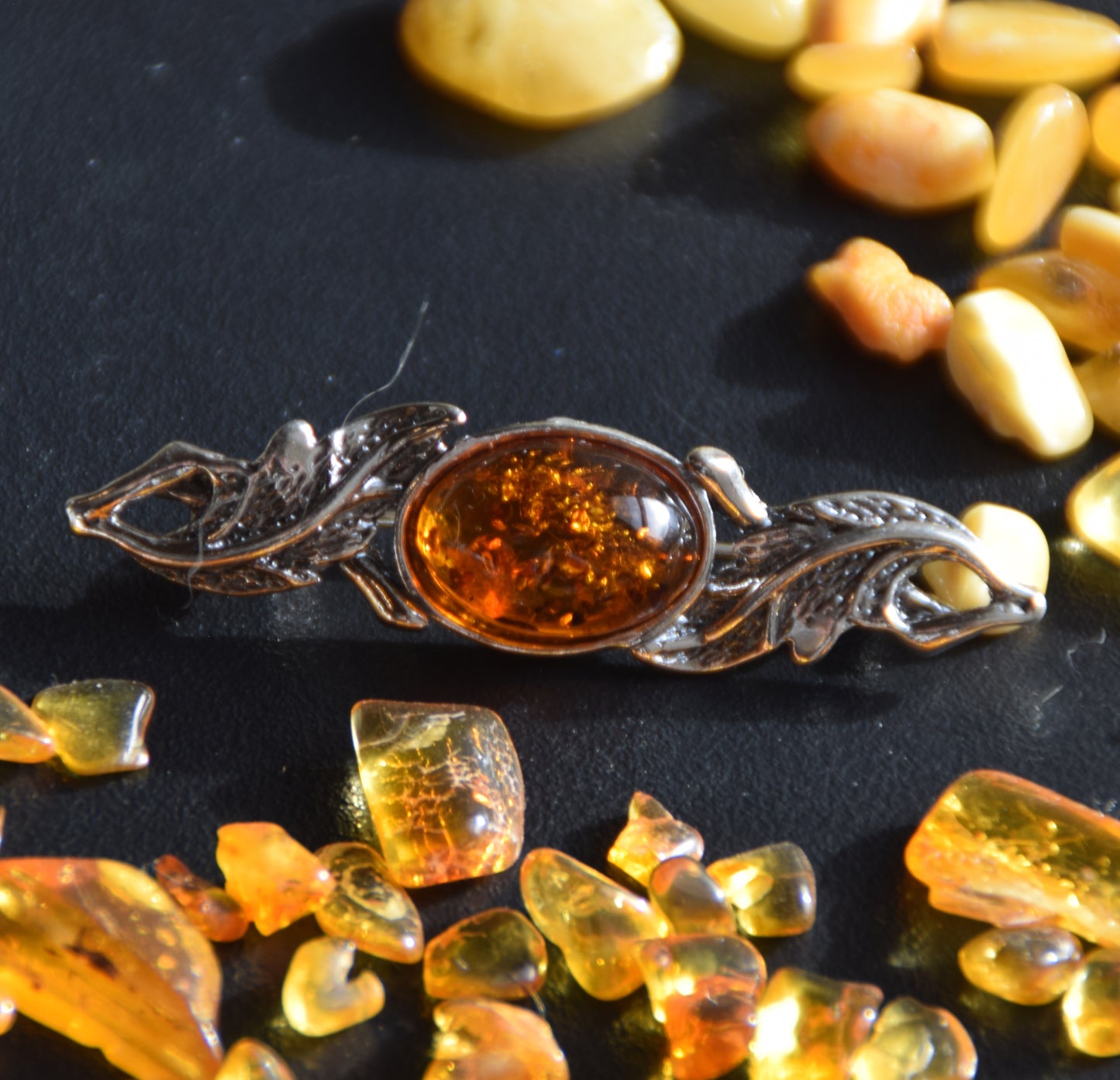 Vintage-style floral design brooch crafted with natural cognac amber and 925 silver, MJ Baltica, BBR017