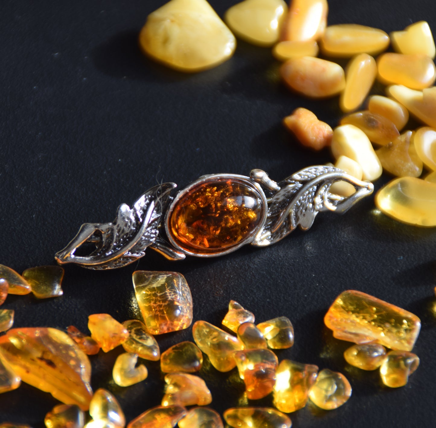 Vintage-style floral design brooch crafted with natural cognac amber and 925 silver, MJ Baltica, BBR017