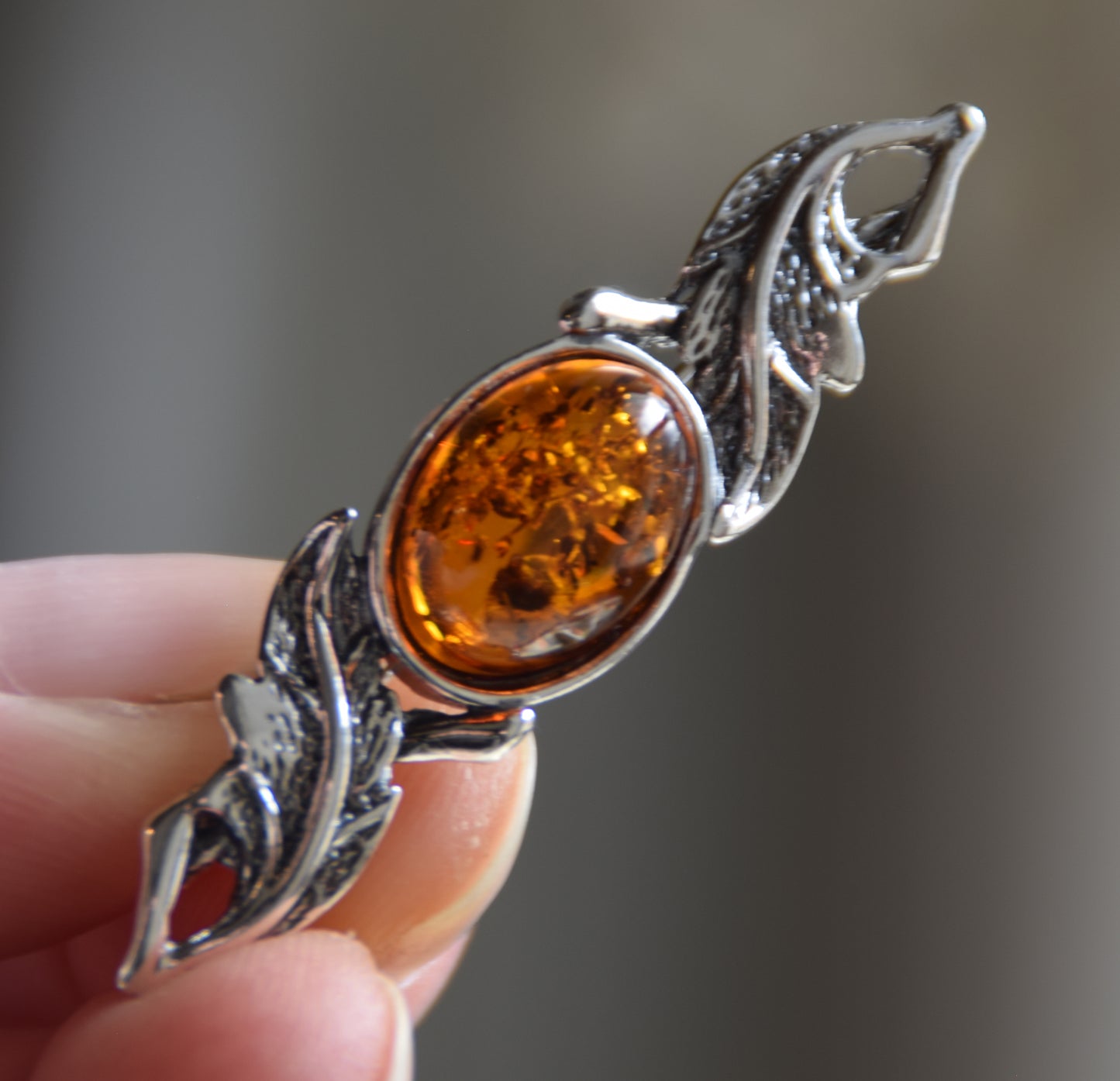 Vintage-style floral design brooch crafted with natural cognac amber and 925 silver, MJ Baltica, BBR017