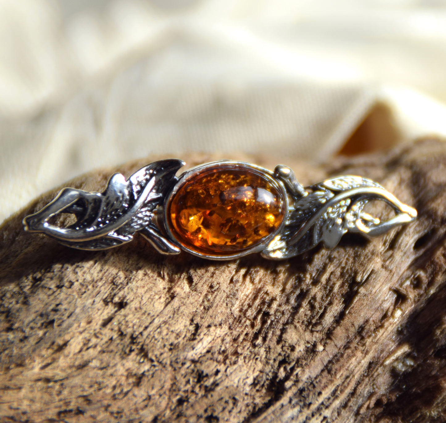 Vintage-style floral design brooch crafted with natural cognac amber and 925 silver, MJ Baltica, BBR017
