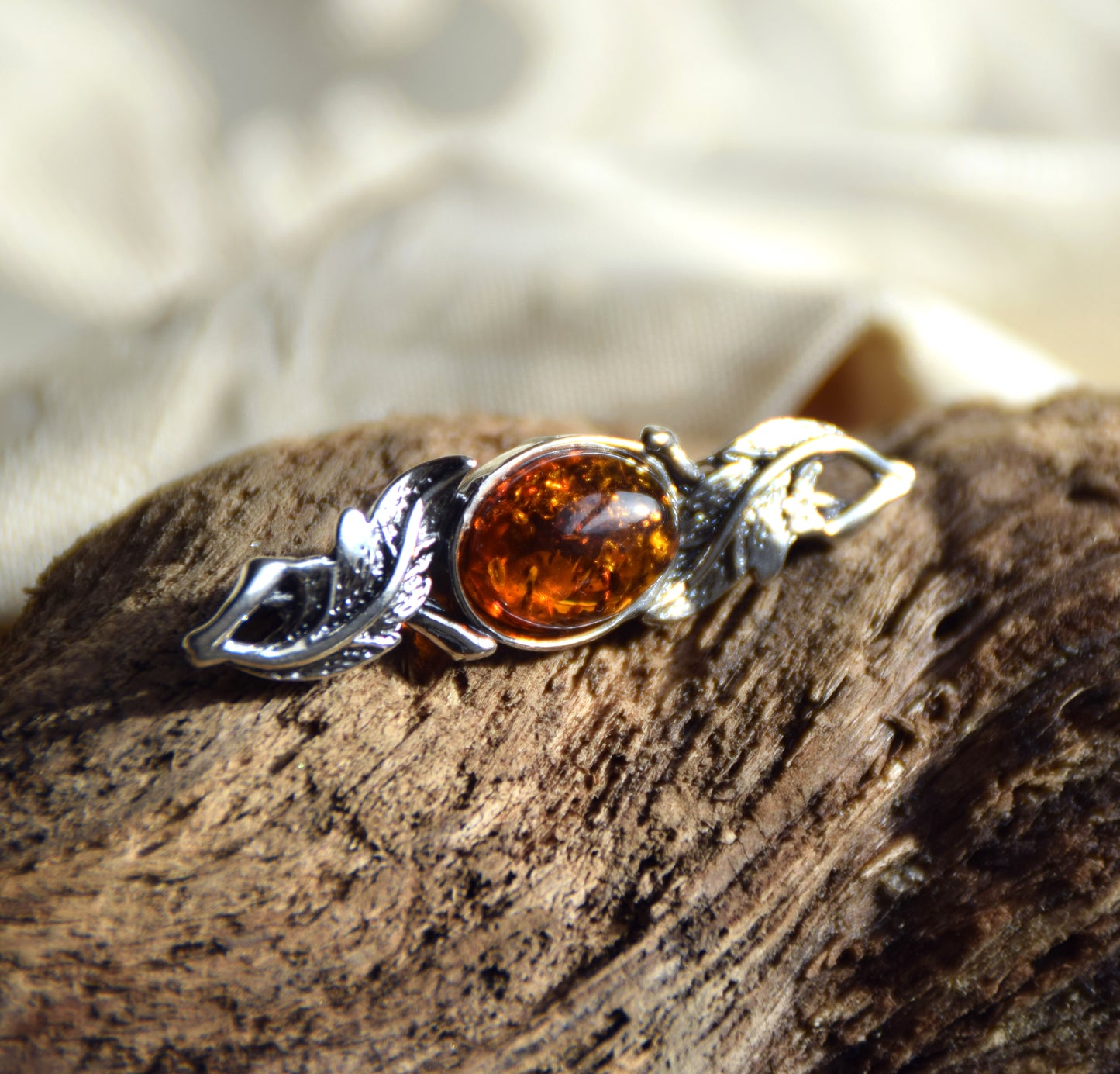 Vintage-style floral design brooch crafted with natural cognac amber and 925 silver, MJ Baltica, BBR017