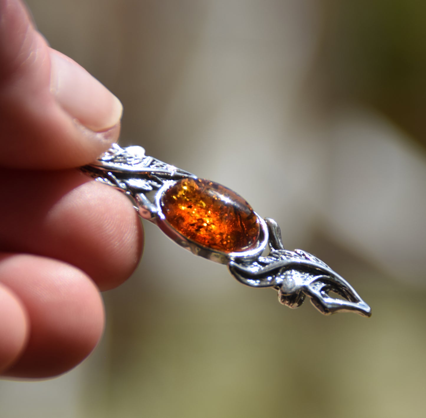 Vintage-style floral design brooch crafted with natural cognac amber and 925 silver, MJ Baltica, BBR017