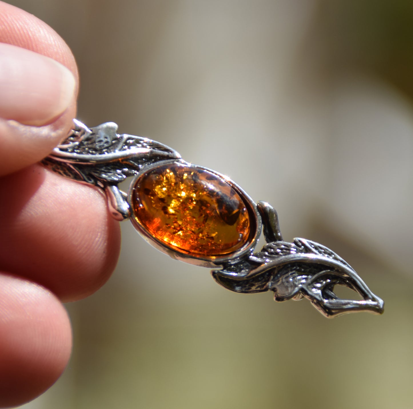 Vintage-style floral design brooch crafted with natural cognac amber and 925 silver, MJ Baltica, BBR017
