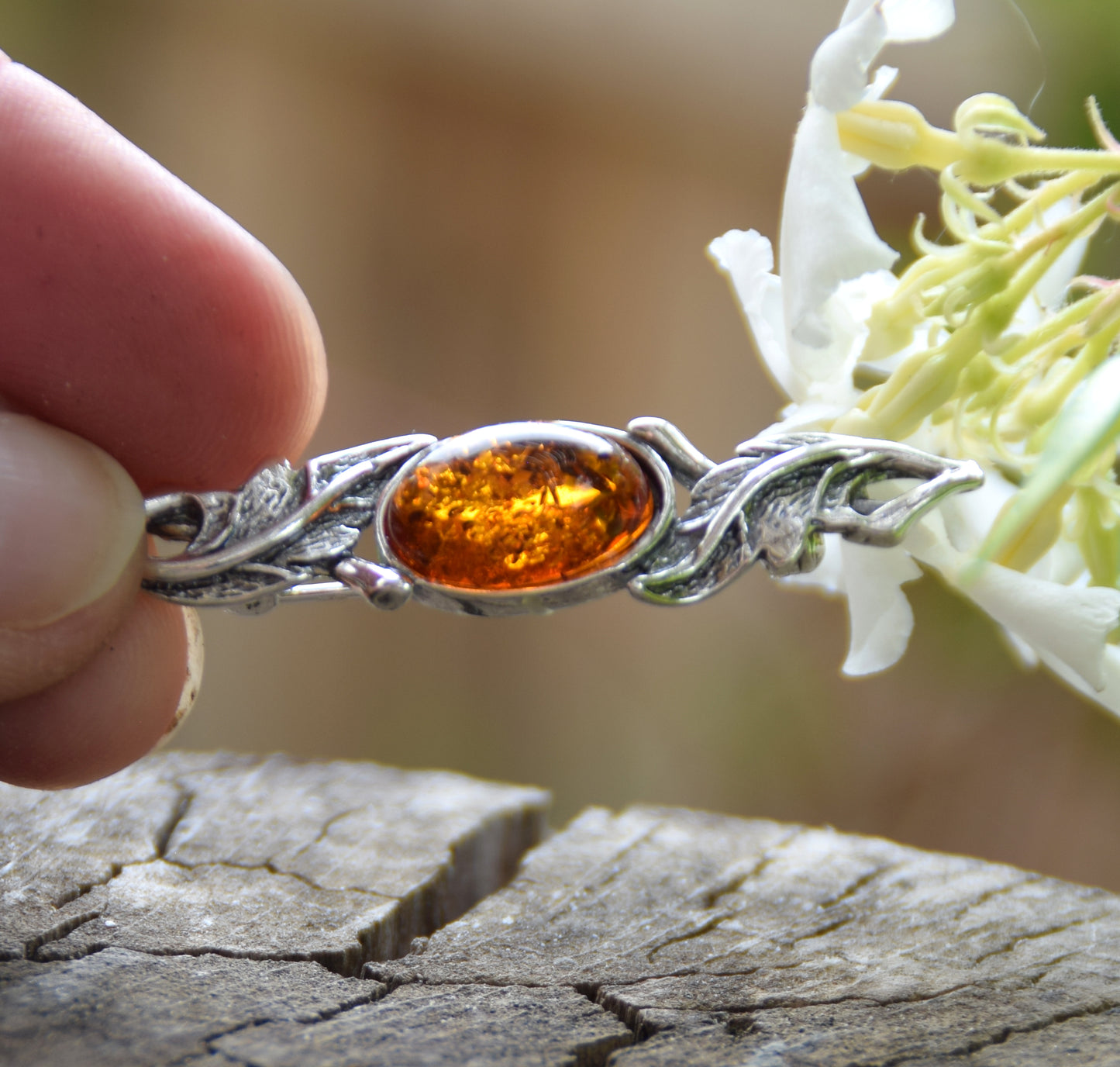 Vintage-style floral design brooch crafted with natural cognac amber and 925 silver, MJ Baltica, BBR017