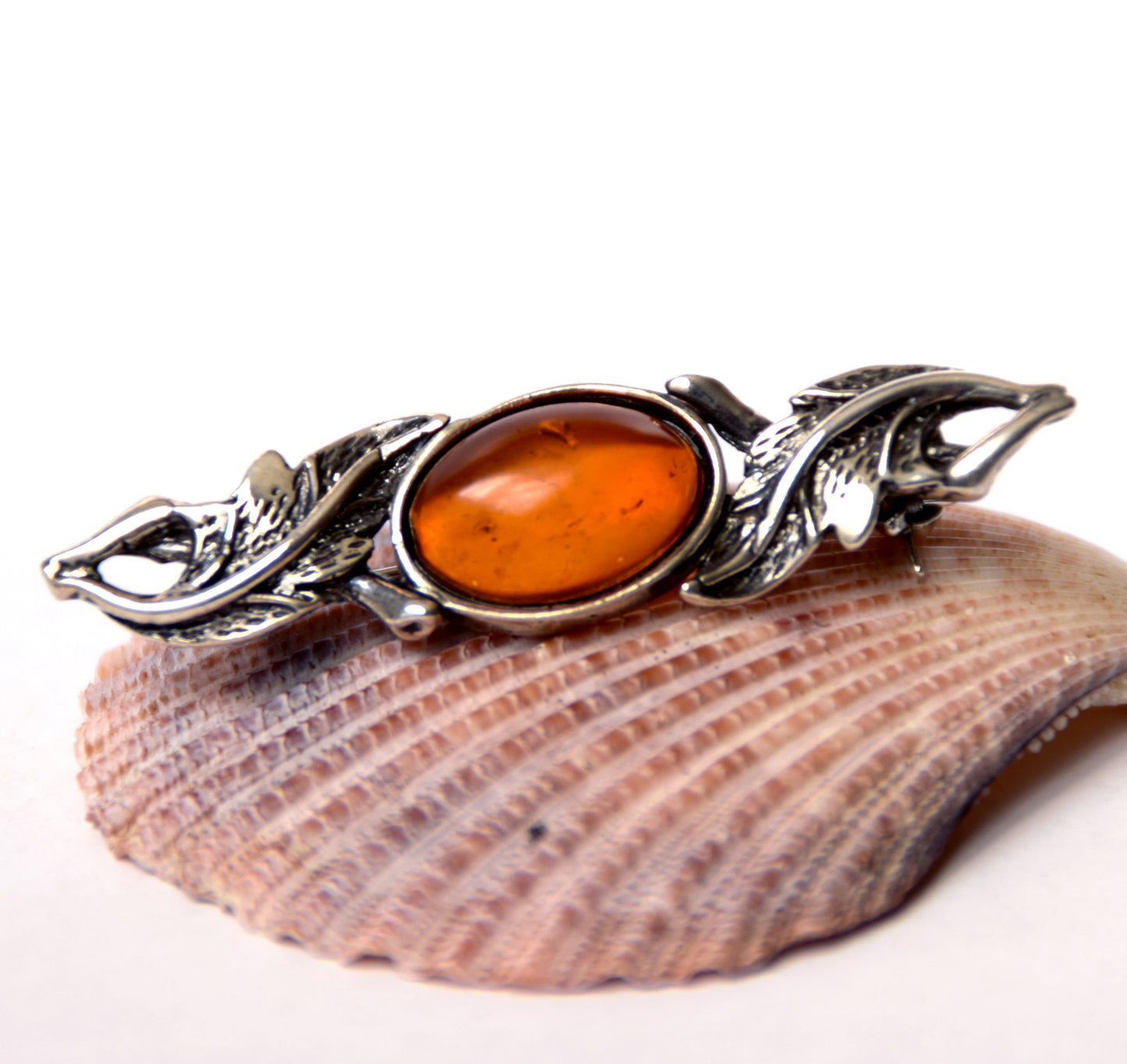Vintage-style floral design brooch crafted with natural cognac amber and 925 silver, MJ Baltica, BBR017
