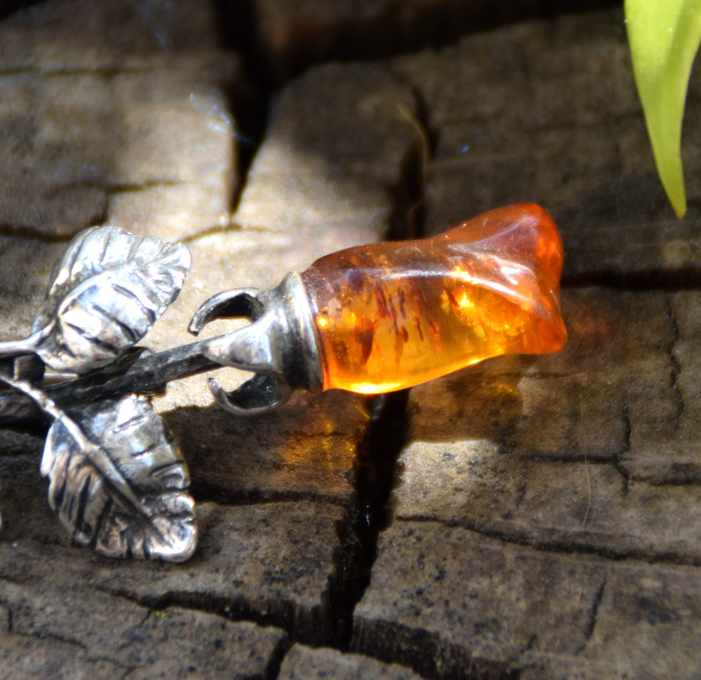 Elegant rose-shaped brooch crafted from natural cognac amber and 925 sterling silver, MJ Baltica, BBR030