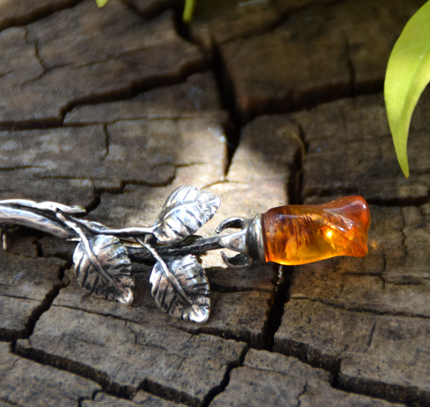 Elegant rose-shaped brooch crafted from natural cognac amber and 925 sterling silver, MJ Baltica, BBR030
