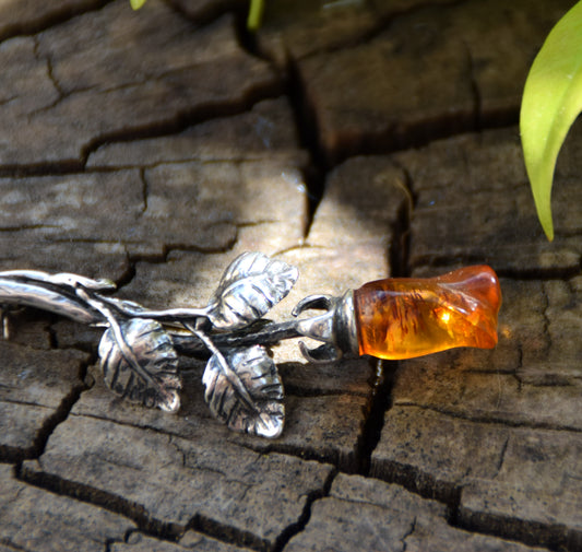 Elegant rose-shaped brooch crafted from natural cognac amber and 925 sterling silver, MJ Baltica, BBR030
