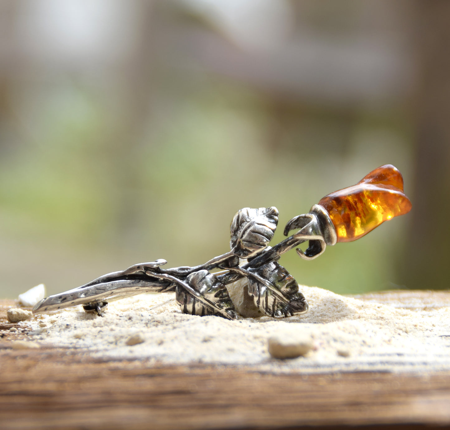 Elegant rose-shaped brooch crafted from natural cognac amber and 925 sterling silver, MJ Baltica, BBR030