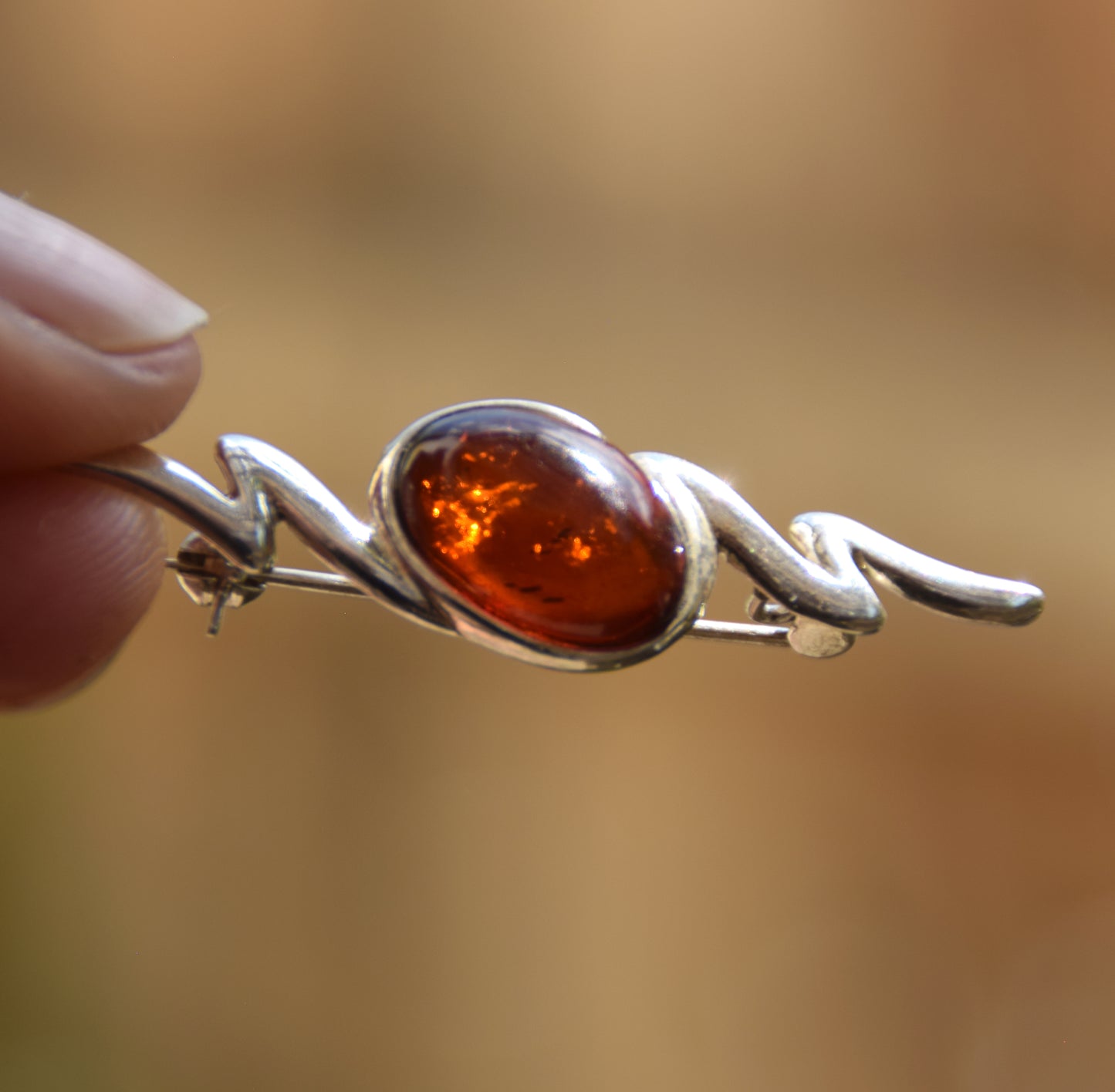 Bright brooch made with dark brown natural Amber and 925 Silver, MJ Baltica, BBR047