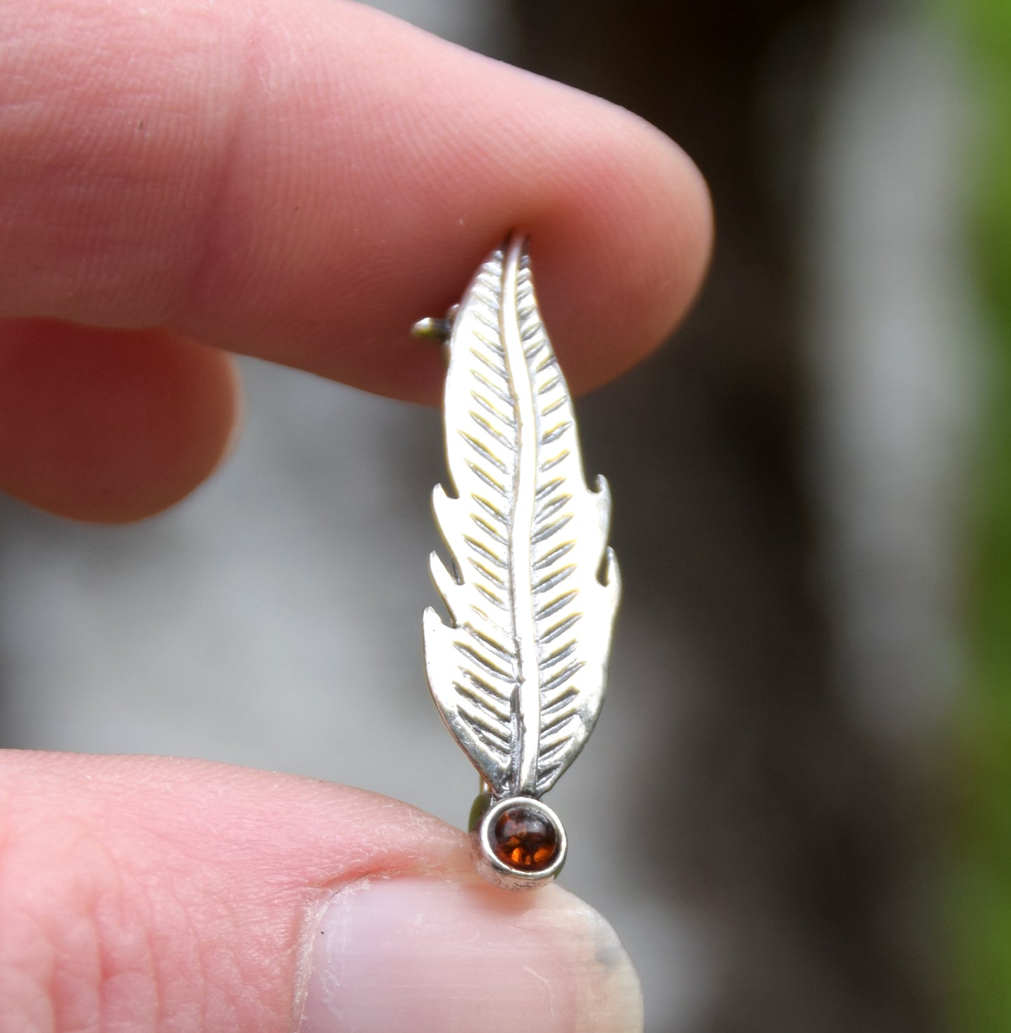 Delicate feather brooch made with natural cognac-colored amber and 925 silver, MJ Baltica, BBR050